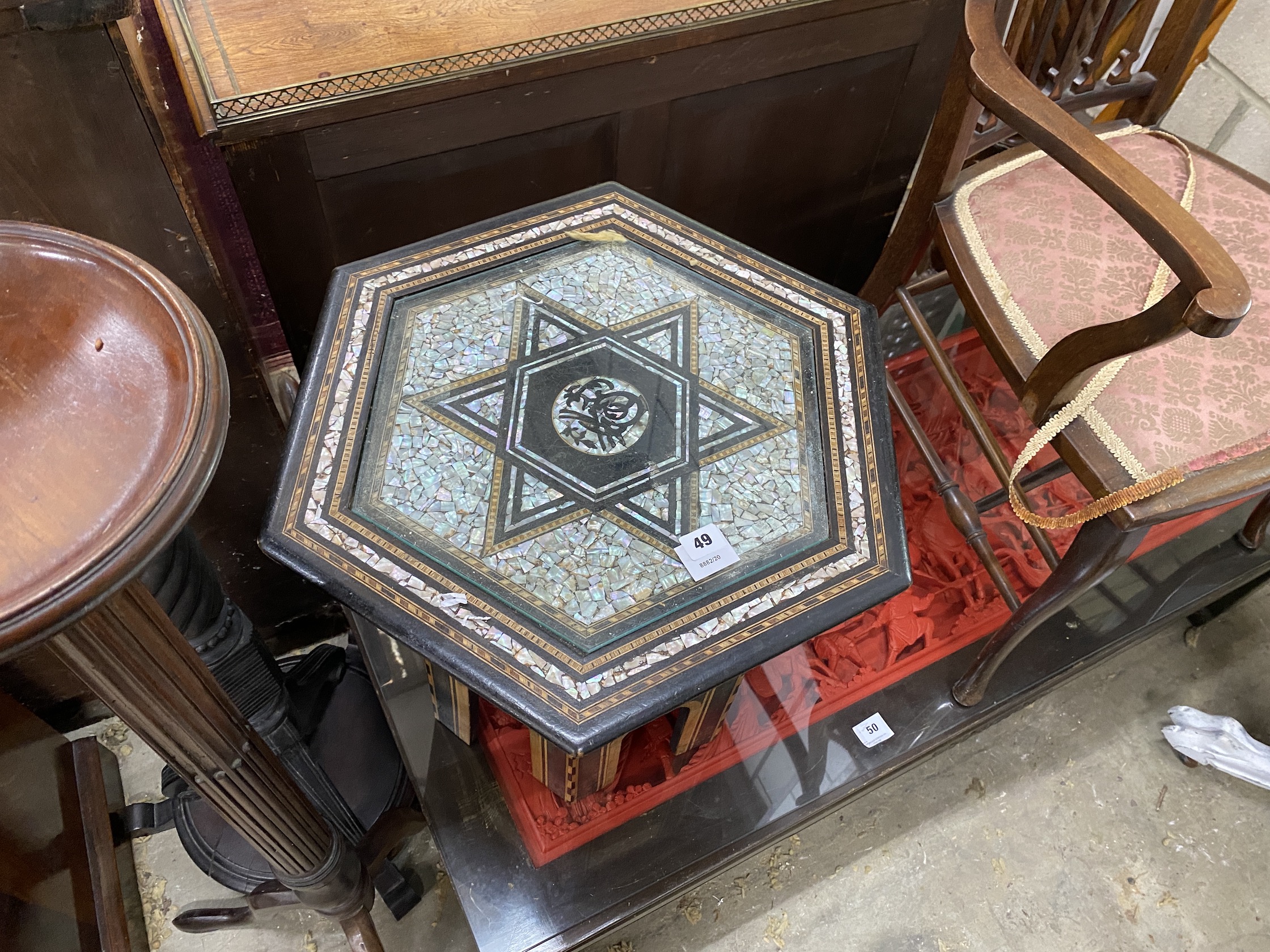 An early 20th century Moorish mother of pearl inlaid hexagonal occasional table, width 49cm, height 50cm